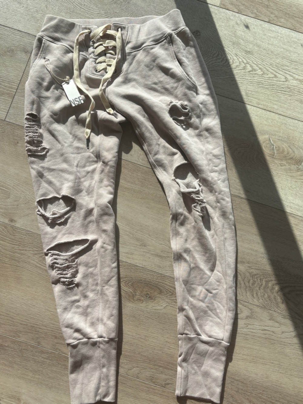 NSF brand laced up distressed sweats/joggers  in Light Beige